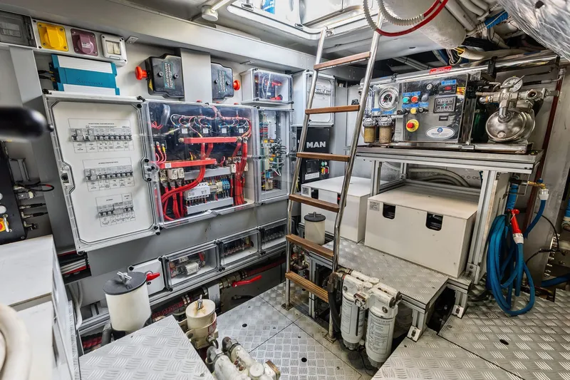 Slide: The Image of Engine room of a 2019 Riva 56' Rivale yacht with electrical panels and equipment. - 52