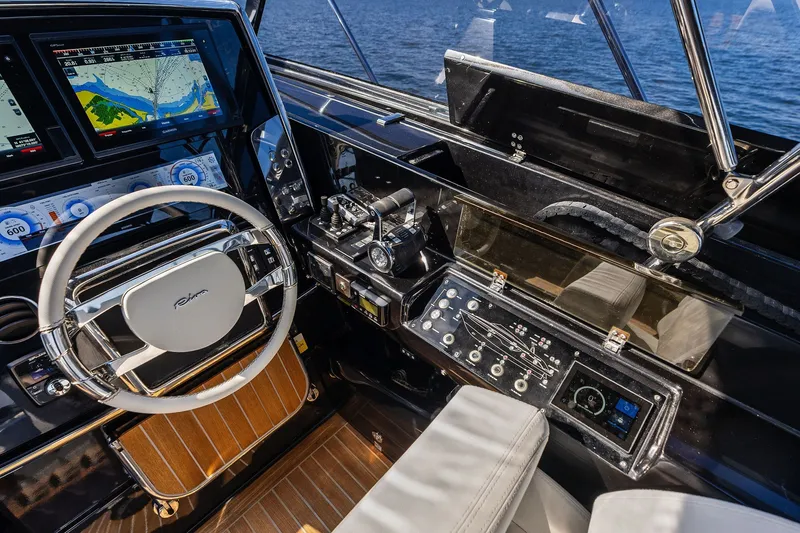 Slide: The Image of Cockpit of 2019 Riva 56' Rivale yacht with navigation screens and steering wheel. - 21