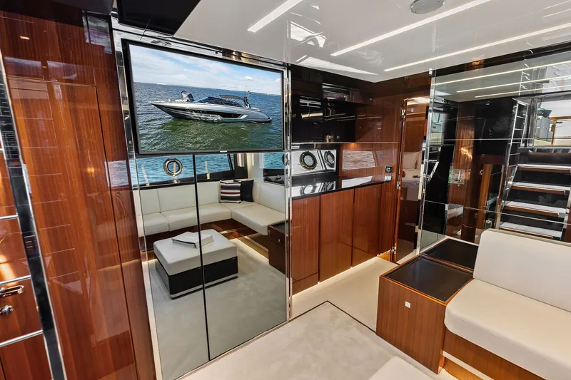 Slide: The Image of Luxurious interior of 2019 Riva 56' Rivale yacht with modern furnishings and large TV display. - 32