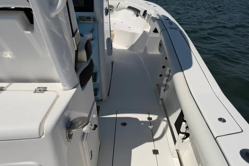 Slide: The Image of 2023 Tidewater 292 CC Adventure boat deck, featuring sleek design and spacious layout. - 25