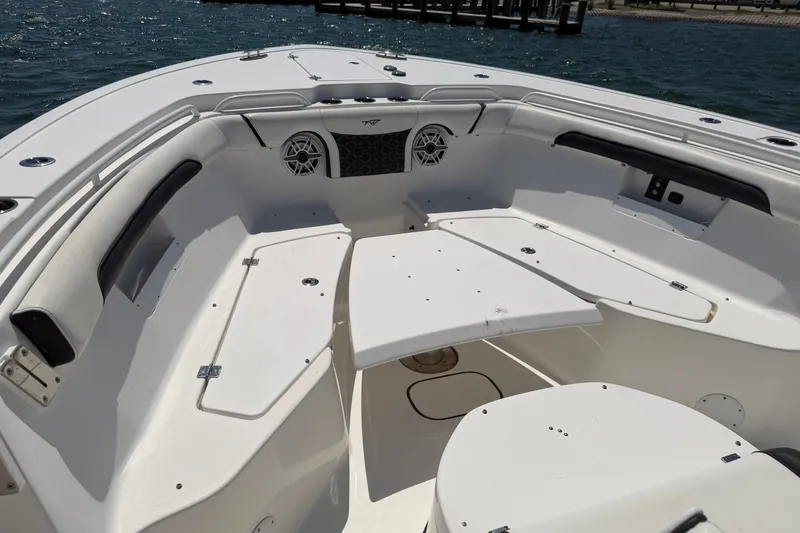 Slide: The Image of 2023 Tidewater 292 CC Adventure boat interior with seating and speakers. - 15