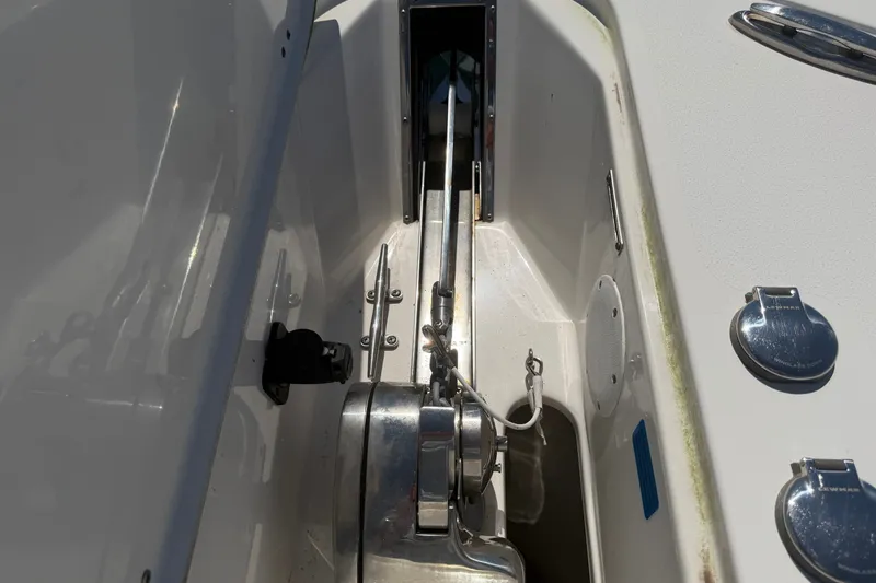 Slide: The Image of Anchor locker of a 2023 Tidewater 292 CC Adventure with stainless steel windlass and chain. - 16