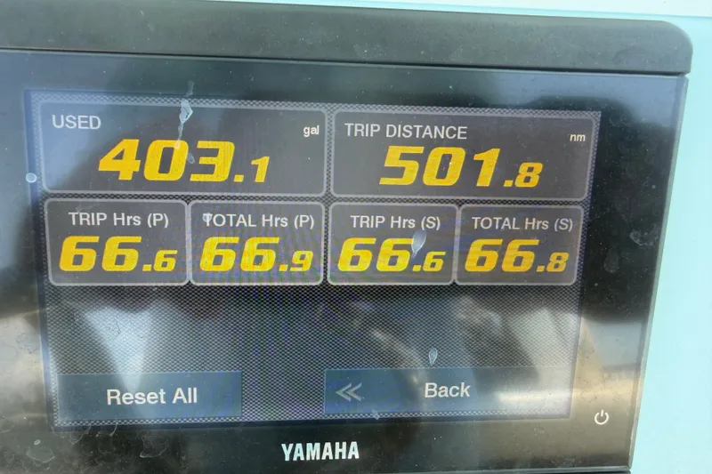 Slide: The Image of Yamaha display showing fuel usage and trip data for 2023 Tidewater 292 CC Adventure. - 6