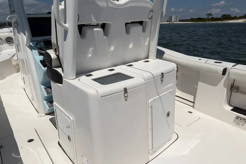 Slide: The Image of 2023 Tidewater 292 CC Adventure boat interior with seating and storage compartments. - 23
