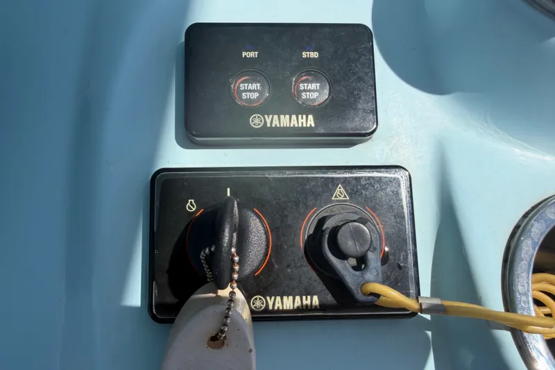 Slide: The Image of Yamaha controls on a 2023 Tidewater 292 CC Adventure boat. - 10