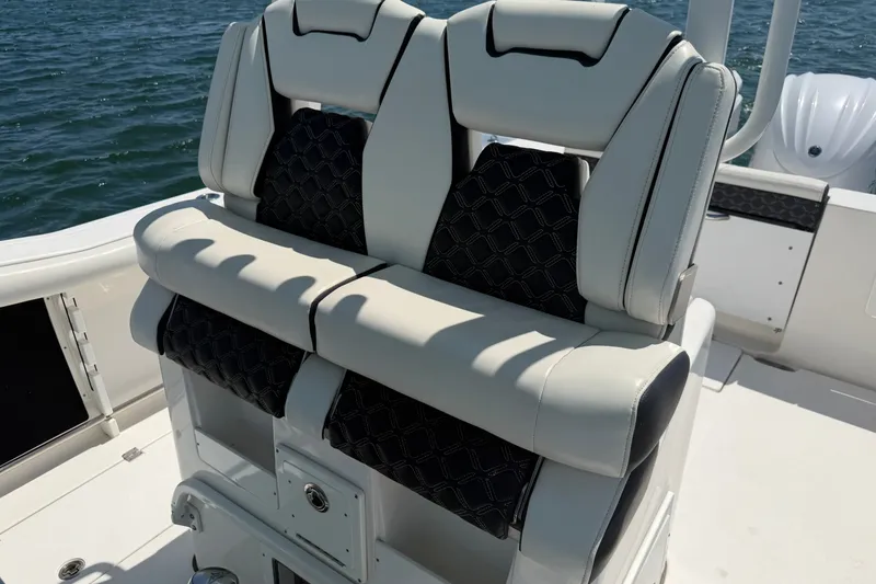 Slide: The Image of 2023 Tidewater 292 CC Adventure boat seats with elegant design on open water. - 18