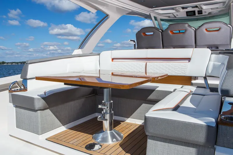 Slide: The Image of Manufacturer Provided Image: 2022 Tiara Yachts 38 LS interior seating area with table, luxury boat design. - 5