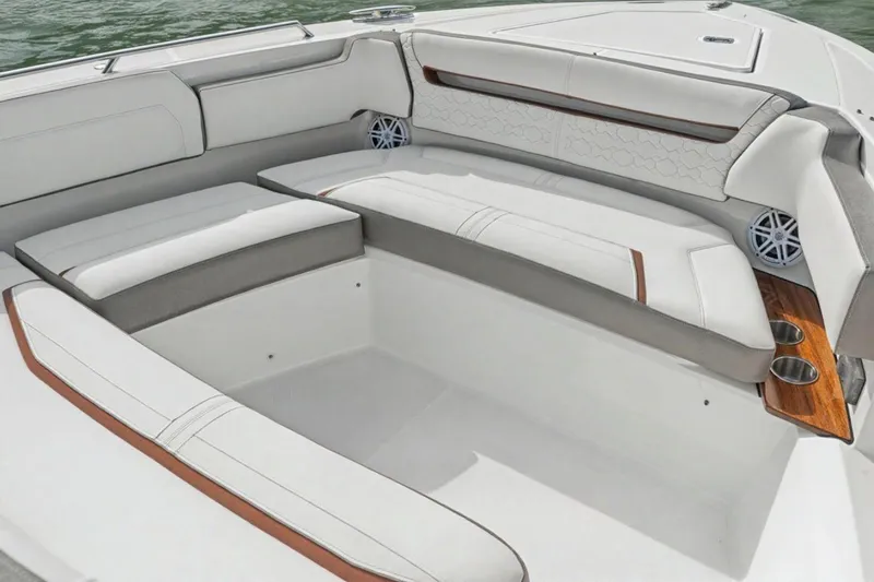 Slide: The Image of Luxurious seating area on 2022 Tiara Yachts 38 LS boat, featuring elegant white upholstery. - 9