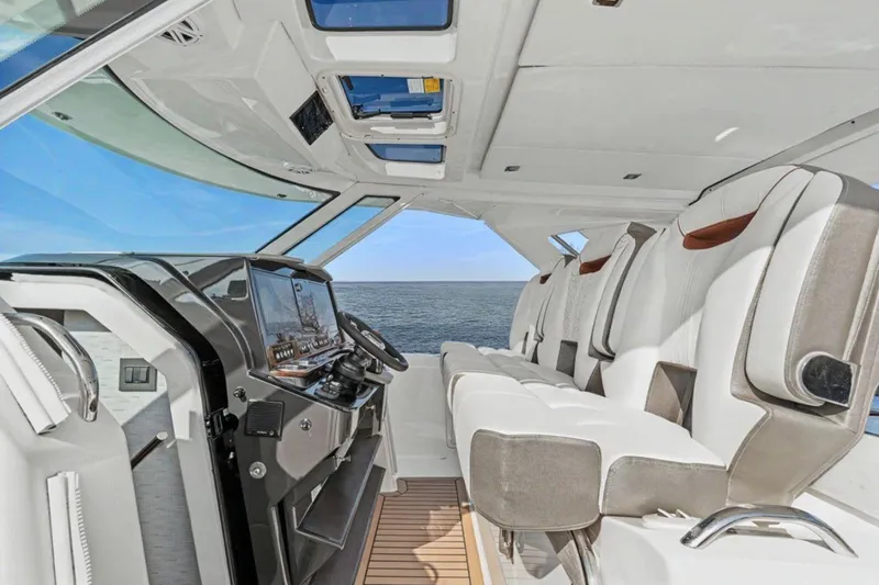 Slide: The Image of 2022 Tiara Yachts 38 LS interior with modern helm and luxurious seating. - 1
