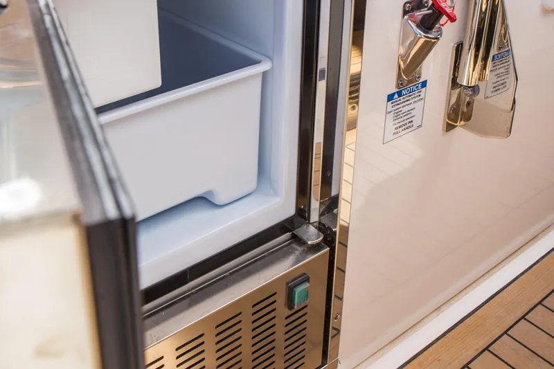 Slide: The Image of Manufacturer Provided Image: Open refrigerator compartment on a 2022 Tiara Yachts 38 LS boat. - 8