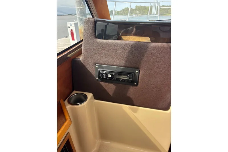 Slide: The Image of Companion seat view on a 2016 Cutwater C-28 boat with a stereo system and cup holder. - 26
