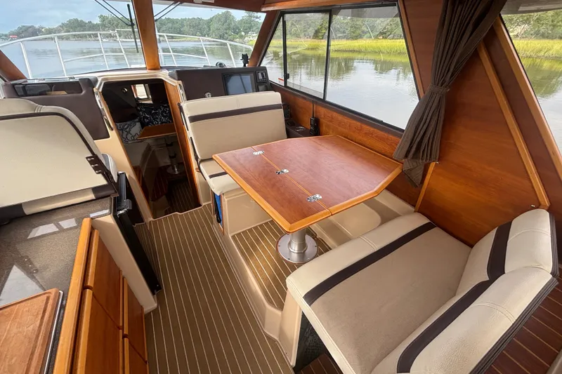 Slide: The Image of Interior of 2016 Cutwater C-28 boat with wood accents and seating area. - 24