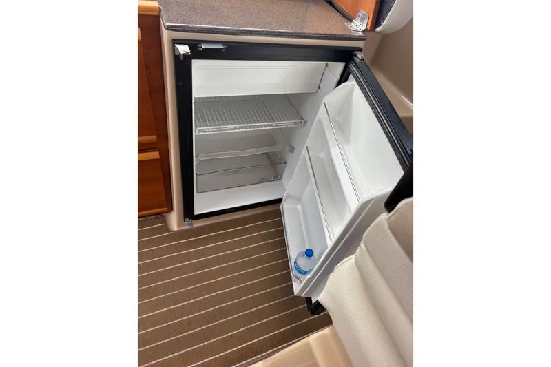 Slide: The Image of Open Dual Voltage refrigerator inside 2016 Cutwater C-28 Galley - 32