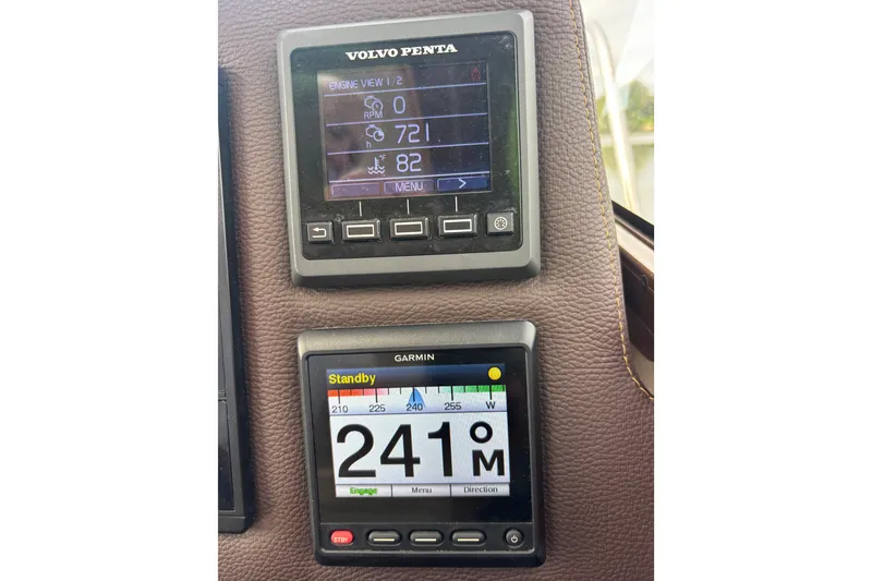 Slide: The Image of Volvo Penta and Garmin displays on 2016 Cutwater C-28 boat dashboard. - 43