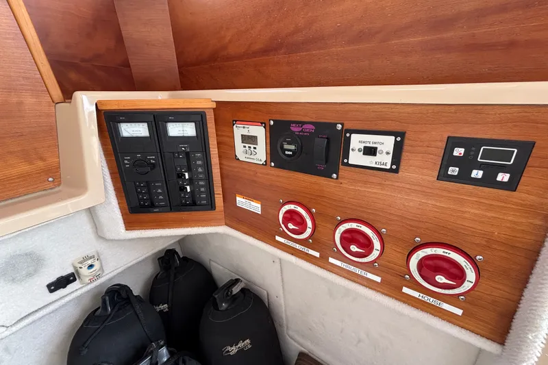 Slide: The Image of Control panel of a 2016 Cutwater C-28 boat with switches and gauges. - 40