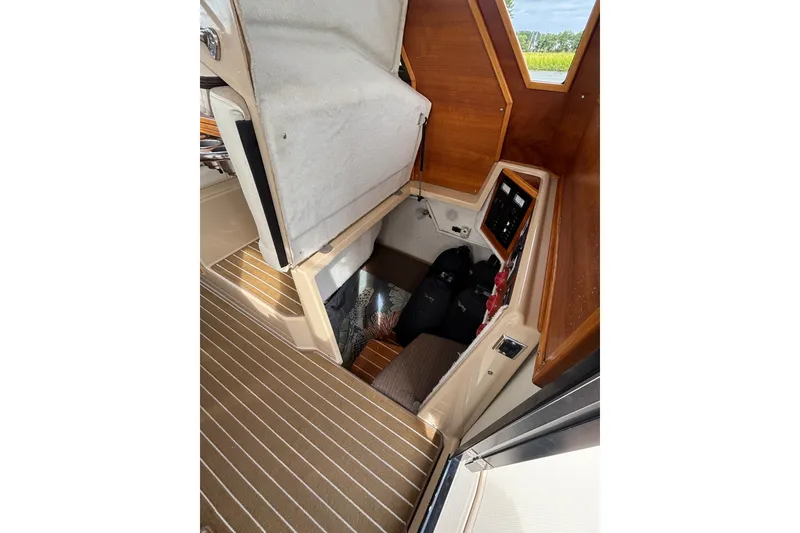Slide: The Image of 2016 Cutwater C-28 - Aft Seat on Dinette lifts to provide access to mid cabin sleeper - 38