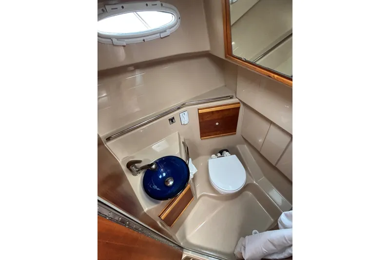 Slide: The Image of 2016 Cutwater C-28 Head/Shower compartment with Vessel Sink, toilet, mirror, and port light - 36