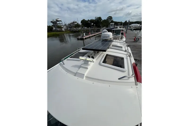 Slide: The Image of 2016 Cutwater C-28 hardtop with solar panel, LED Light Bar, hand railing and Garmin 4 kw radar dome. - 19