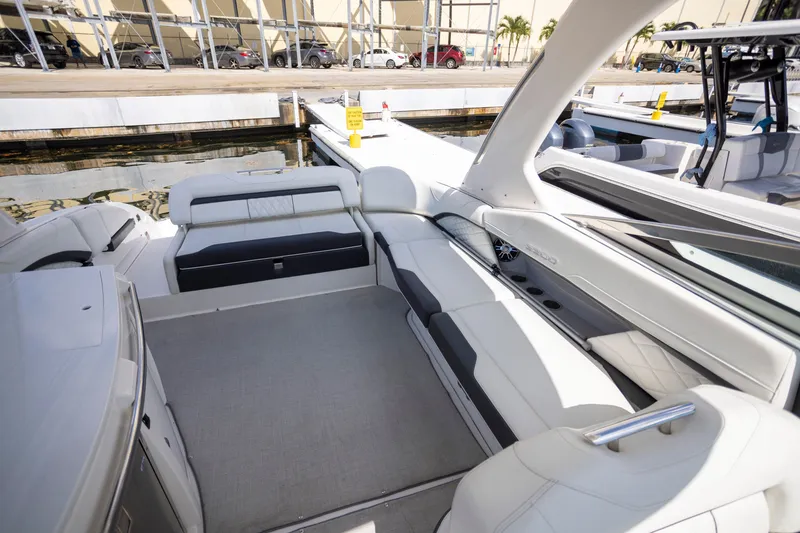 Slide: The Image of 2023 Regal 3300 Bowrider interior with spacious seating and modern design at dockside. - 13