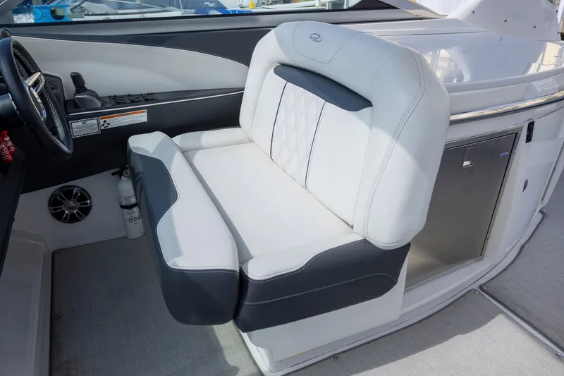 Slide: The Image of 2023 Regal 3300 Bowrider cockpit with luxurious seating and modern controls. - 17