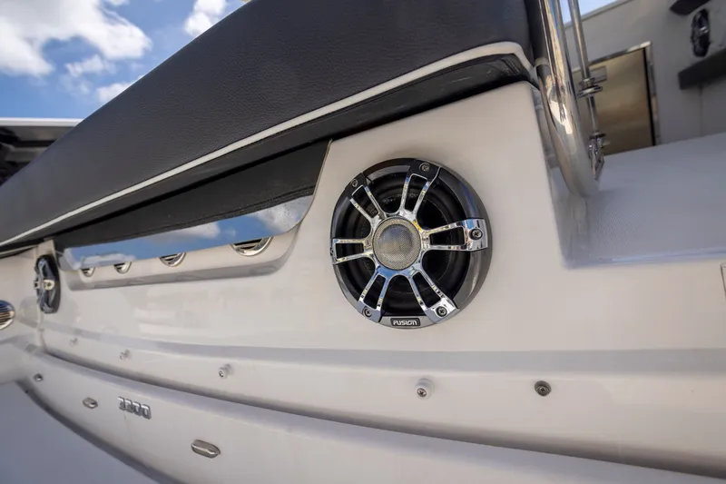 Slide: The Image of 2023 Regal 3300 Bowrider boat speaker detail with sleek design and chrome accents. - 11