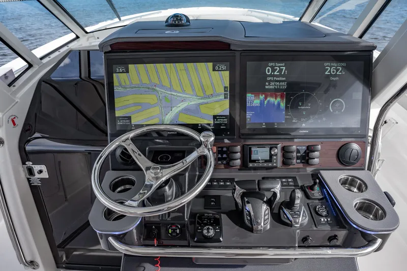 Slide: The Image of 2022 Pursuit S 428 Sport boat dashboard with advanced navigation and control systems. - 20