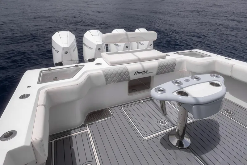 Slide: The Image of 2021 Front Runner 39 Center Console boat with spacious deck and multiple outboard engines. - 8