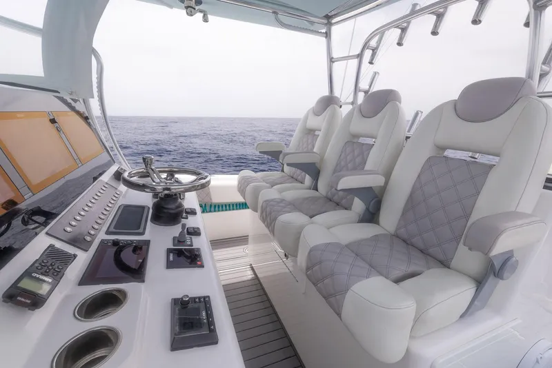 Slide: The Image of 2021 Front Runner 39 Center Console boat interior with luxurious seating and advanced controls. - 13