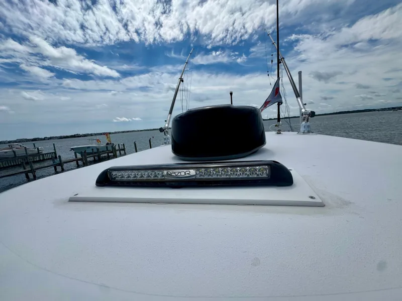 Slide: The Image of The boat features a flat, white surface with an LED light bar and antennas. - 21