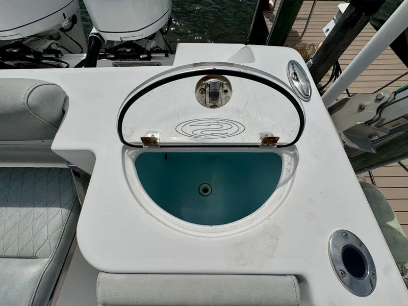 Slide: The Image of A livewell on a 2019 Sportsman Open 252 Center Console boat. - 14