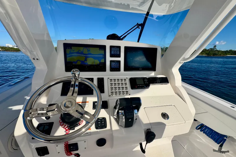 Slide: The Image of 2020 Intrepid 375 Nomad SE helm with advanced navigation displays and controls. - 27