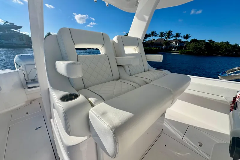 Slide: The Image of Luxurious seating on 2020 Intrepid 375 Nomad SE boat, with scenic waterfront view. - 24