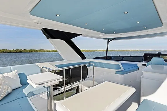 Slide: The Image of Luxurious 2027 Cruisers Yachts 50 Fly interior with modern seating and scenic water view. - 24