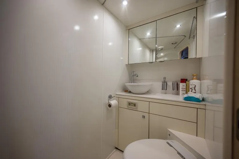 Slide: The Image of Luxurious bathroom interior on 2012 Sunseeker Manhattan 73 yacht, featuring modern fixtures and ample lighting. - 78