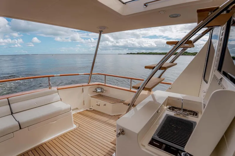 Slide: The Image of Luxurious 2006 Marlow 72E LRC yacht deck with ocean view and seating area. - 9