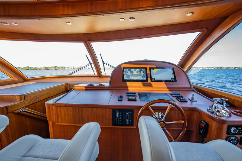 Slide: The Image of 2006 Vicem 62 Custom yacht helm with wooden dashboard and dual screens. - 46
