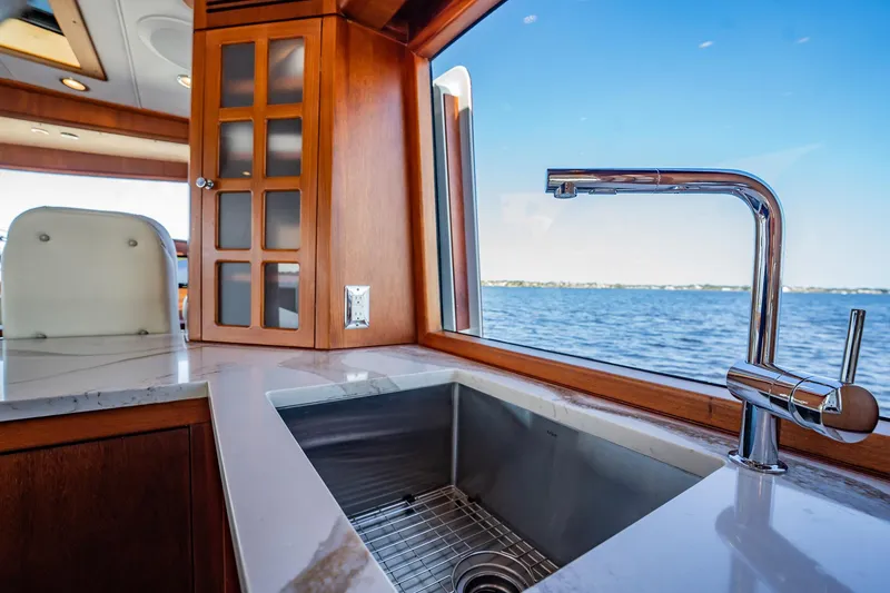 Slide: The Image of Luxurious kitchen sink area on 2006 Vicem 62 Custom yacht with ocean view. - 42