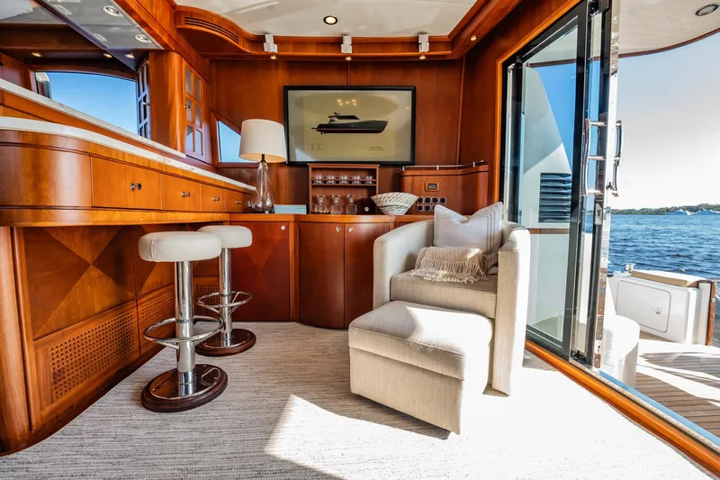 Slide: The Image of Luxurious interior of 2006 Vicem 62 Custom yacht with elegant wood finishes and waterfront view. - 28