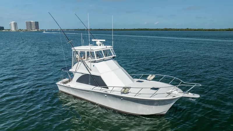 Slide: The Image of 1991 Jersey 42 Convertible Sportfisherman boat on open water. - 11