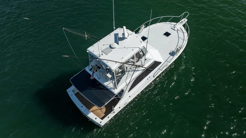 The Image of 1991 Jersey 42 Convertible Sportfisherman boat on open water, aerial view. - 8