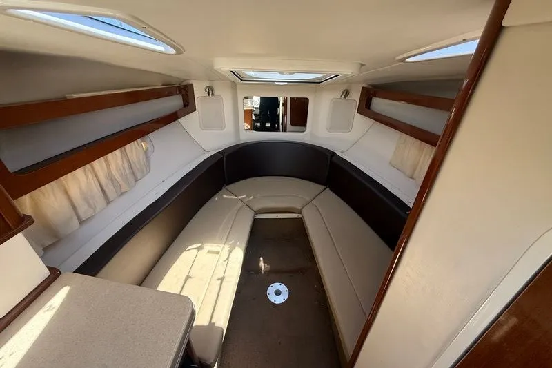 Slide: The Image of Interior cabin of 2014 Sea Ray 265 Sedan Bridge with seating and skylight. - 14