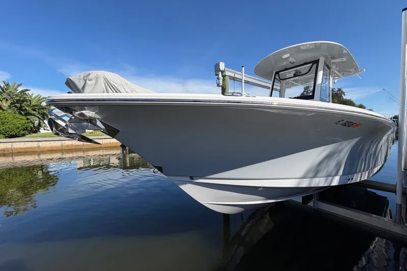 The Image of 2025 Sea Hunt Gamefish 27CB boat docked on a sunny day. - 0