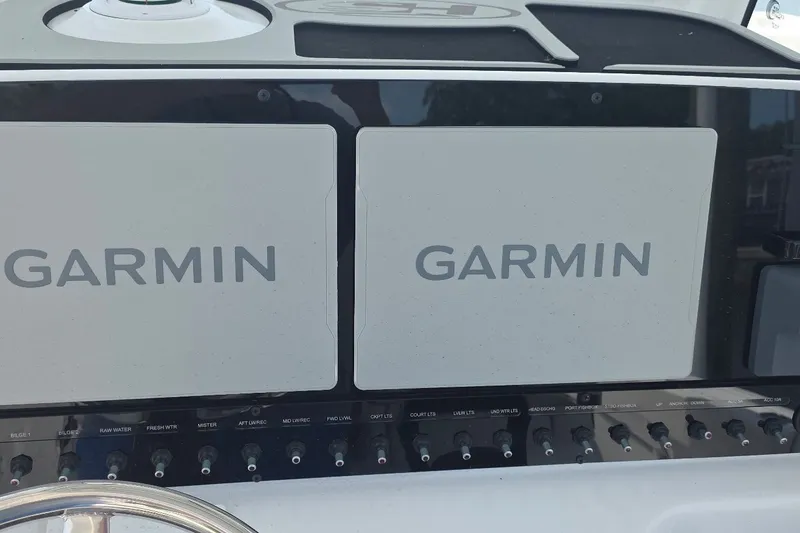 Slide: The Image of Dashboard of 2025 Sea Hunt Gamefish 27CB with dual Garmin displays. - 22