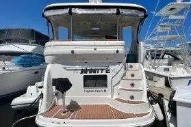 Slide: The Image of 2004 Sea Ray 390 Motor Yacht docked at marina, rear view. - 1
