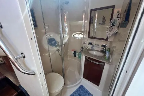 Slide: The Image of Luxurious bathroom in 2004 Sea Ray 390 Motor Yacht with shower and vanity. - 27