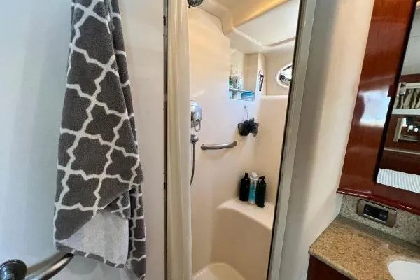 Slide: The Image of Shower area in 2004 Sea Ray 390 Motor Yacht with towel and toiletries. - 22