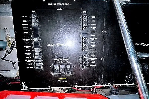 Slide: The Image of Main DC breaker panel of 2004 Sea Ray 390 Motor Yacht, featuring switches and controls. - 34