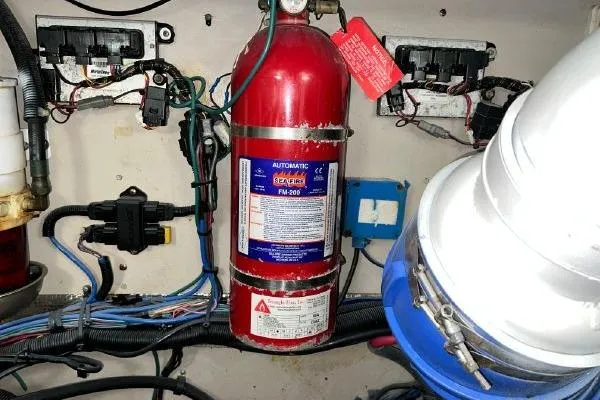 Slide: The Image of Engine room of 2004 Sea Ray 390 Motor Yacht with fire extinguisher and wiring. - 30