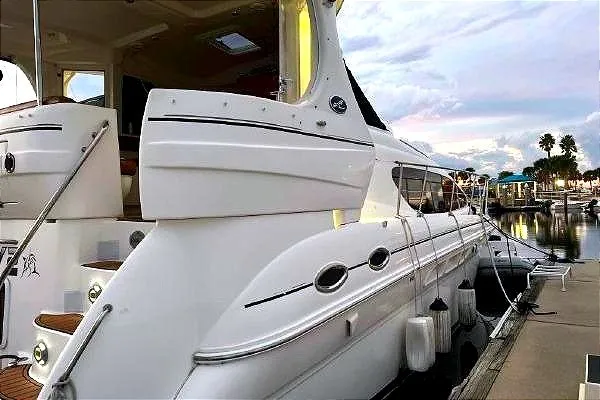 Slide: The Image of 2004 Sea Ray 390 Motor Yacht docked at marina, showcasing sleek design and luxury features. - 4