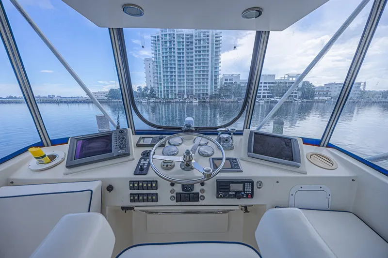 Slide: The Image of Interior view of 1973 Hatteras 36 Sport Fisherman boat cockpit with navigation equipment. - 16